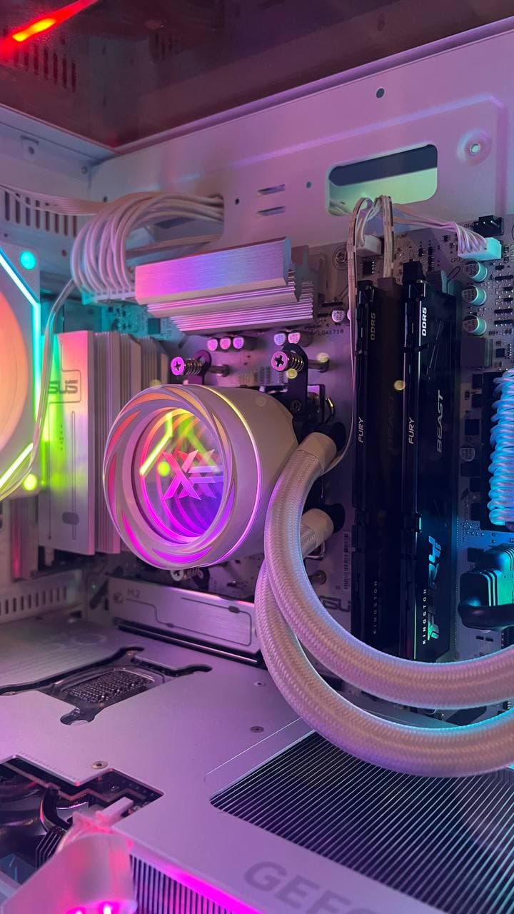 Close-up of a ForgePC build with liquid cooling and braided tubing